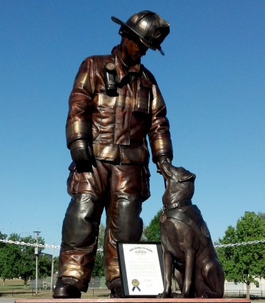 Statue of a firefighter with his dog